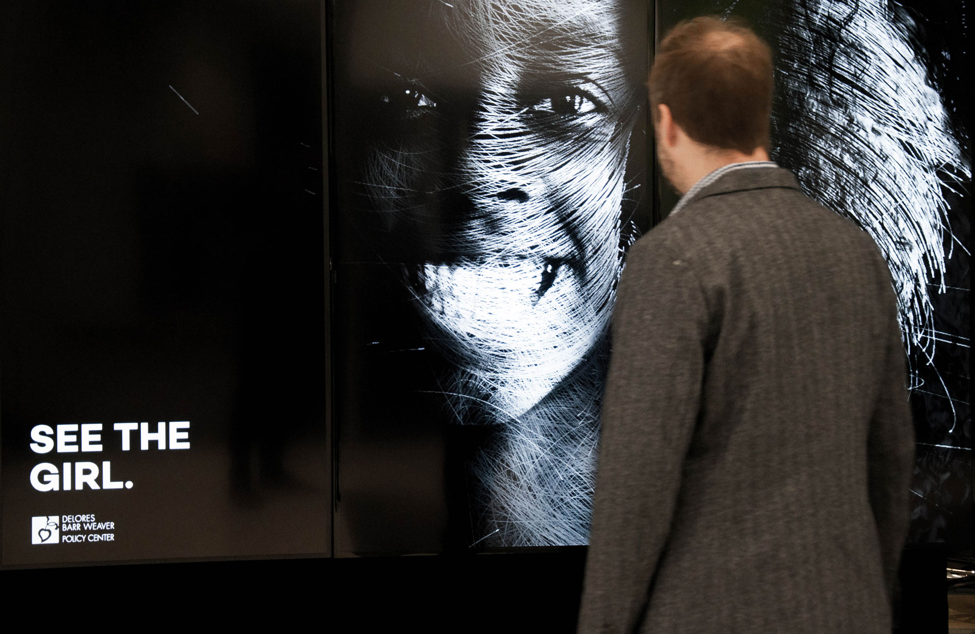 A man looking at the interactive display