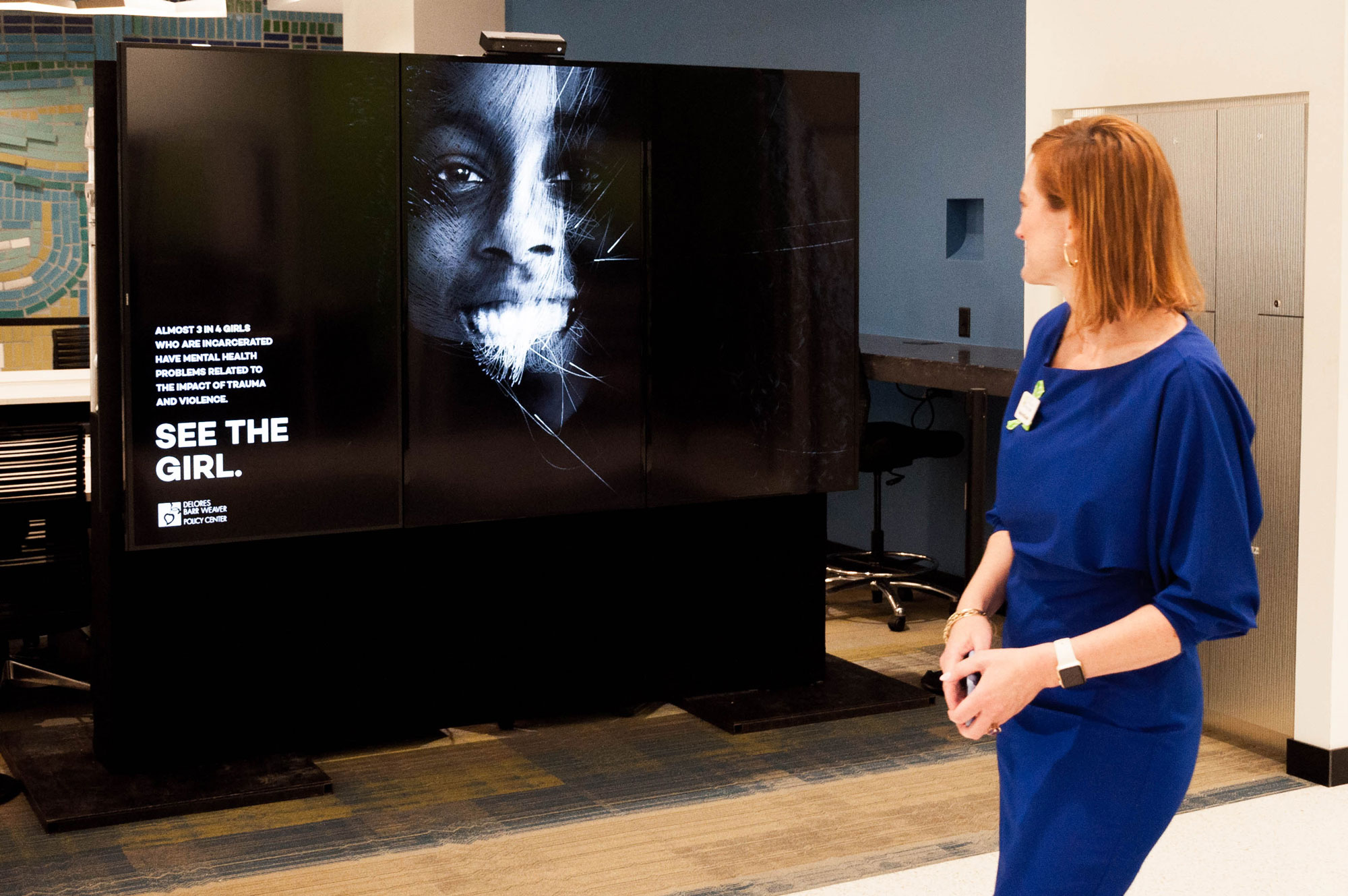 A woman looking at the interactive display