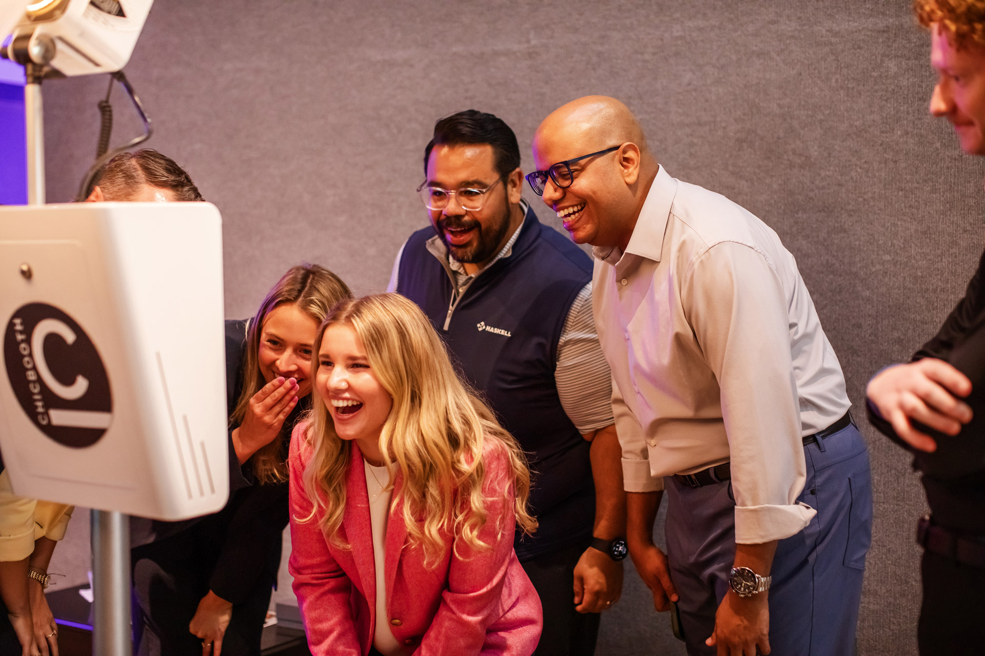 Photo-Booth-1 A group of people standing in front of a photo booth