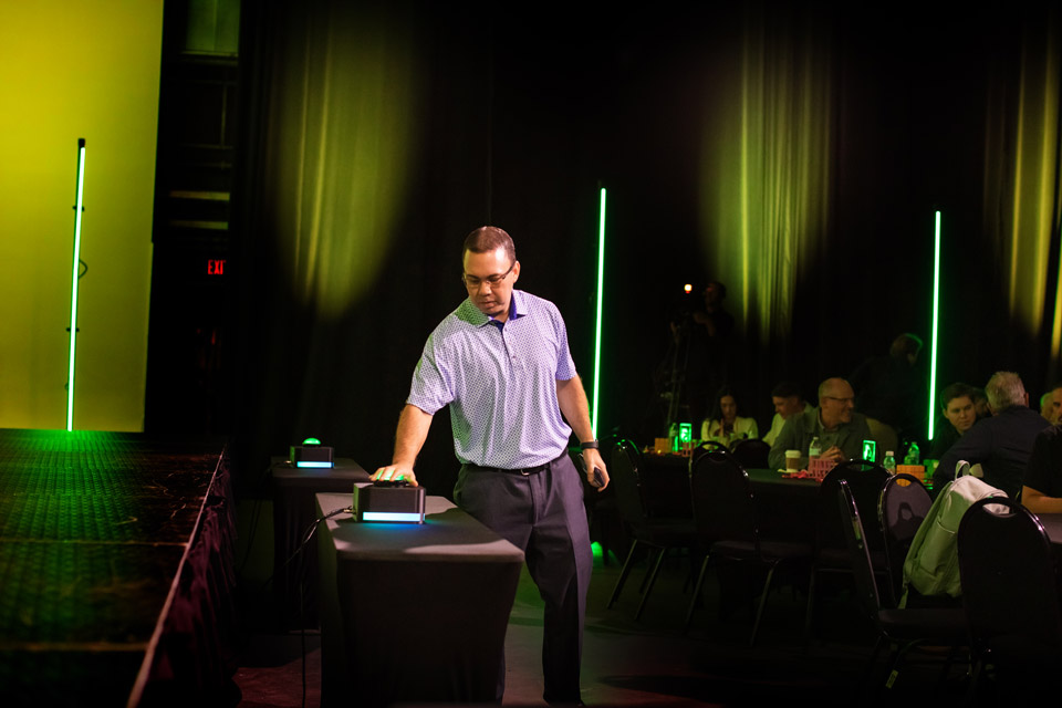 Vote-Image-2 An image of a person pressing a large green button, submitting a vote