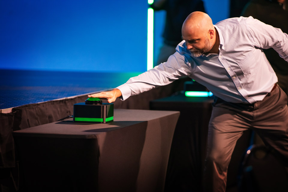 Vote-Image-3 An image of a hand pressing a large green button, submitting a vote