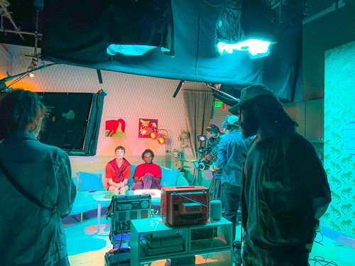 A behind the scenes photo of a video set