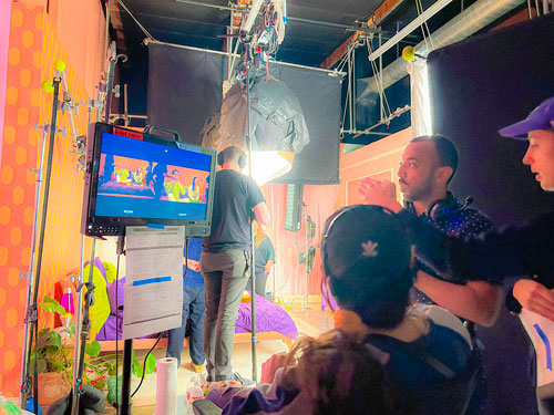 A behind the scenes photo of a video set