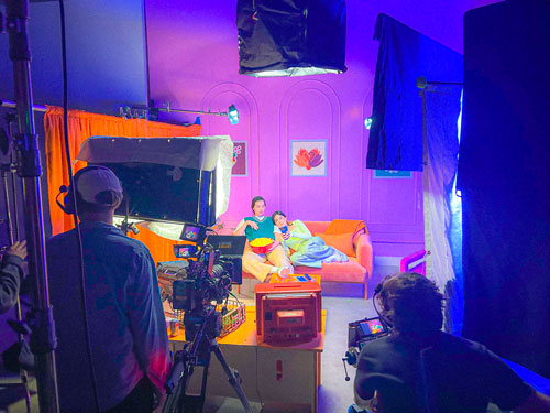 A behind the scenes photo of a video set